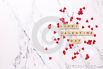 Romantic layout. Wooden latters on white marble background. Stock Photo