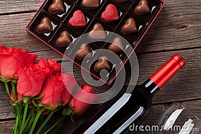 Valentines day with red roses, wine and chocolate Stock Photo