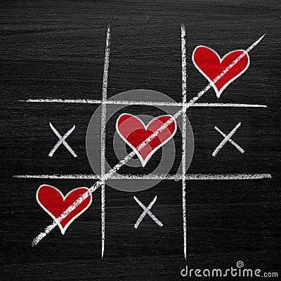 Valentines Day style chalk hearts, XO noughts and crosses Stock Photo