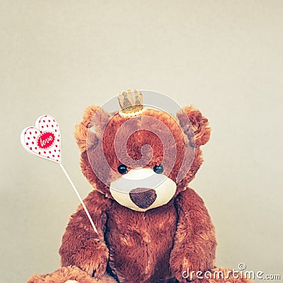 Valentines Day Teddy bear holding heart. Retro romantic style. Unusual creative greeting card Stock Photo