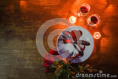 Valentines dinner romantic love conceptRomantic table setting decorated with fork spoon on plate and couple champagne glass wine Stock Photo