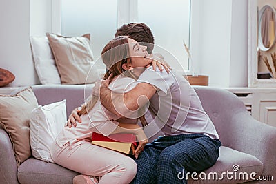 Valentines morning boyfriend giving a gift for his girlfriend she is very happy Stock Photo