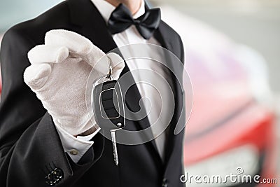 Valet Boy Holding A Car Key Stock Photo