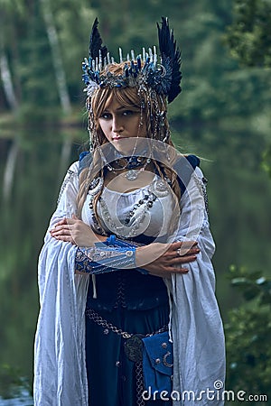 Valkyrie warrioress in magpie costume. Stock Photo