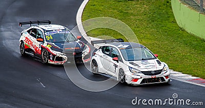 Honda and Opel acing touring cars action challenging and overtaking during Editorial Stock Photo
