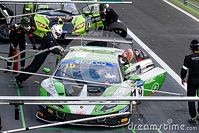Refuelling race car team working at pit stop during endurance race on Editorial Stock Photo