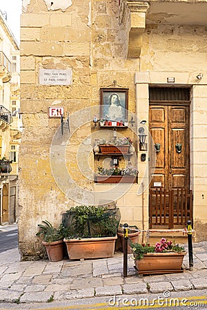 a religious icon on the wall in Valletta, Malta Editorial Stock Photo