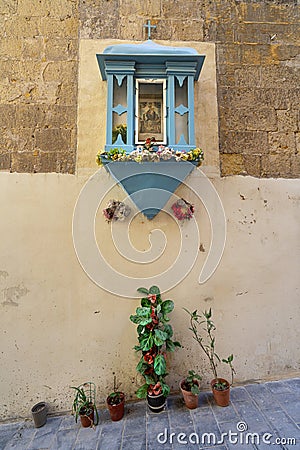 a religious icon on the wall in Valletta, Malta Editorial Stock Photo