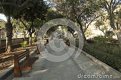 Valletta, Malta, August 2019. Beautiful shady alley of a city park. Editorial Stock Photo
