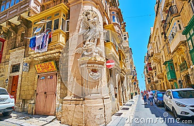 The cityscape with St Michael`s niche, Valletta, Malta Editorial Stock Photo