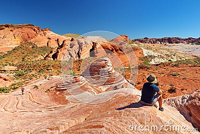 VALLEY OF FIRE, NEVADA, USA - APRIL 2016: Beautiful red and white stripes of the Fire Wave sandstone formation in Valley of Fire Editorial Stock Photo