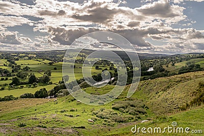 A valley with sheep and rain clouds Stock Photo