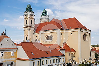 Valtice, Southern Moravia, Czech Republic, 04 July 2021: Baroque church of the Assumption of the Virgin Mary at Freedom Square at Editorial Stock Photo