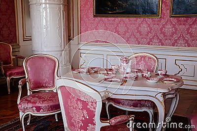 Valtice, Southern Moravia, Czech Republic, 04 July 2021: Castle interior with baroque furniture, dining room or pink salon with Editorial Stock Photo