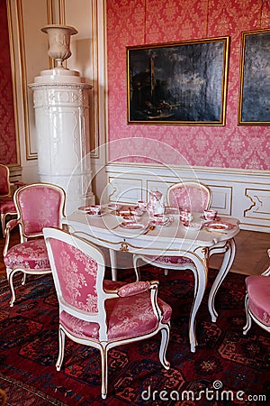 Valtice, Southern Moravia, Czech Republic, 04 July 2021: Castle interior with baroque furniture, dining room or pink salon with Editorial Stock Photo
