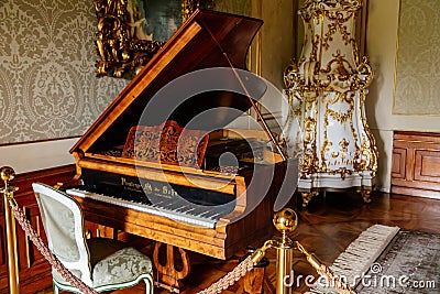 Valtice, Southern Moravia, Czech Republic, 04 July 2021: Castle interior, baroque wooden carved furniture, music room with antique Editorial Stock Photo