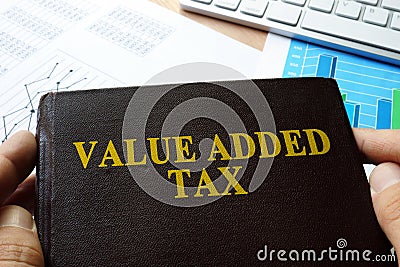 Value added tax VAT written on a book. Stock Photo