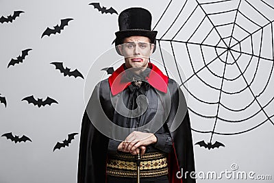 Vampire Halloween Concept - Portrait of handsome caucasian in Vampire halloween costume with sad facial expression. Stock Photo