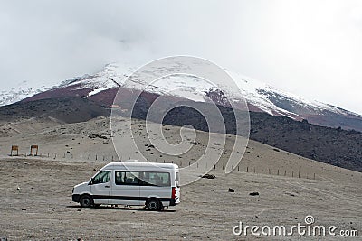 Van in a lot below the glacier on Cotopaxi Volcano Editorial Stock Photo