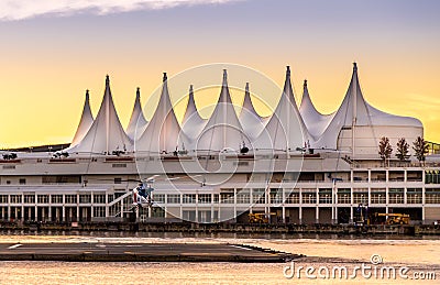 VANCOUVER, BC, CANADA - SEPT 12, 2015: A BC Air Ambulance helicopter landing on the pad in front of Canada Place in Editorial Stock Photo