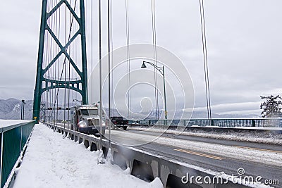 A View of Lions Gate Bridge covered in snow. Snow storm and extreme weather in Vancouver. Editorial Stock Photo
