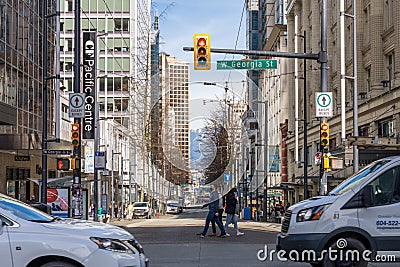 Vancouver City Centre street view. People and cars crossing Granville St and W Georgia St. Editorial Stock Photo