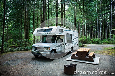 Vancouver Island, Canada, 20 august, 2019 // :Old Tioga caravan parked in a camping area in typical British Columbia camping Editorial Stock Photo