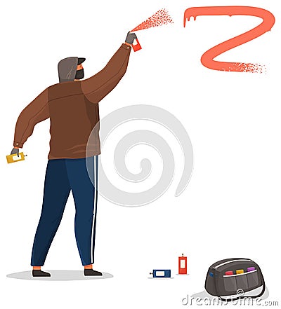 Vandal damaging city building. Bully in hood and balaclava painting graffiti Stock Photo