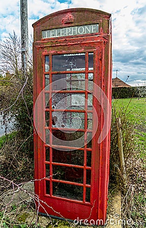 Vandalised English phone box Editorial Stock Photo