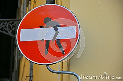 Vandalized street sign, art stickers by an original artist named Clet Stock Photo