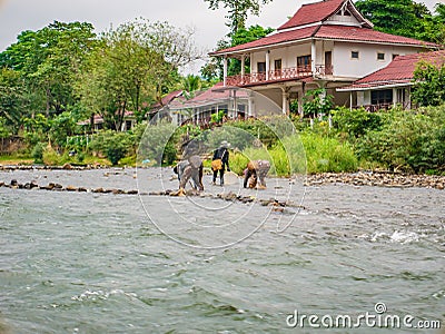 Unacquainted Local people fishing on namsong river at vangvieng city Laos. Editorial Stock Photo