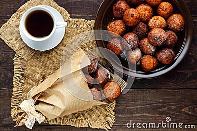 Vanilla cheese balls, deep fried and a cup of tea. Lovely breakfast. Stock Photo