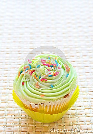 Vanilla cupcake with lime icing Stock Photo