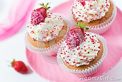 Vanilla cupcakes decorated strawberries Stock Photo