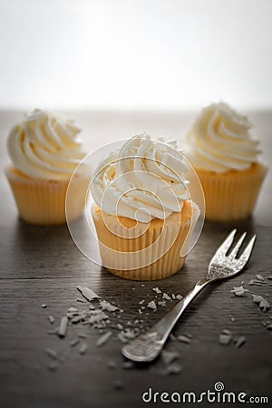 Vanilla cupcakes frosting with butter cream. Stock Photo