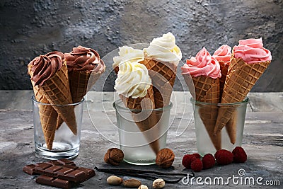 Vanilla frozen yogurt or soft ice cream in waffle cone Stock Photo