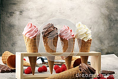 Vanilla frozen yogurt or soft ice cream in waffle cone. Stock Photo