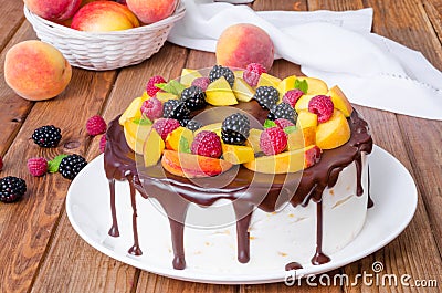 Vanilla mousse cake with peaches and chocolate glaze Stock Photo