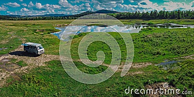 Vanlife living in central Romania, exploring romania with an expedition vehicle, with beautiful lakes in the background Stock Photo