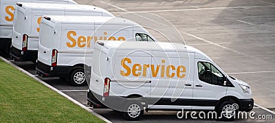 Vans are parked in row. Commercial fleet Stock Photo