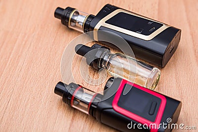 Vaping electronic mod and vape liquid. Stock Photo