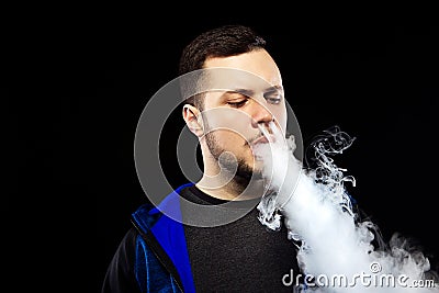 Vaping man and a cloud of vapor Stock Photo