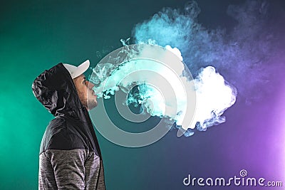 Vaping man and a cloud of vapor Stock Photo