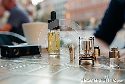 Vaping set on the table against the background of the city Stock Photo
