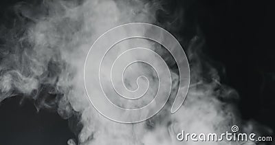 Vapor steam rising over black background Stock Photo