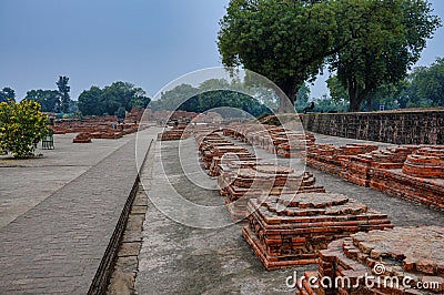 Varanasi, India - Dec 25, 2019: Dhamekh Stupa in Panchaytan temple ruins, Sarnath, Varanasi, India Editorial Stock Photo