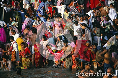 Hindu pilgrims bathe in Ganges Editorial Stock Photo