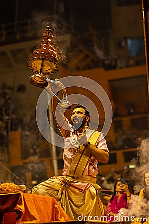 Priest performing ganga aarti at dasaswamedh ghat in varanasi Editorial Stock Photo