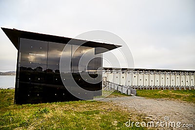 Vardo, Norway - 23 June 2019: Black kube building which is memorial devoted to memory innocently killed during witch hunting. Editorial Stock Photo