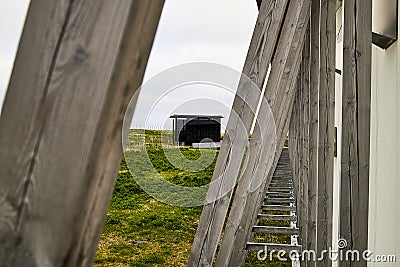 Vardo, Norway - 23 June 2019: Black kube building which is memorial devoted to memory innocently killed during witch hunting. Editorial Stock Photo